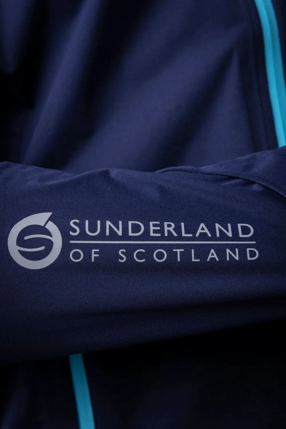 SUNDERLAND Whisperdry Pro-Lite Waterproof Golf Jacket - Mens - Navy / Aqua